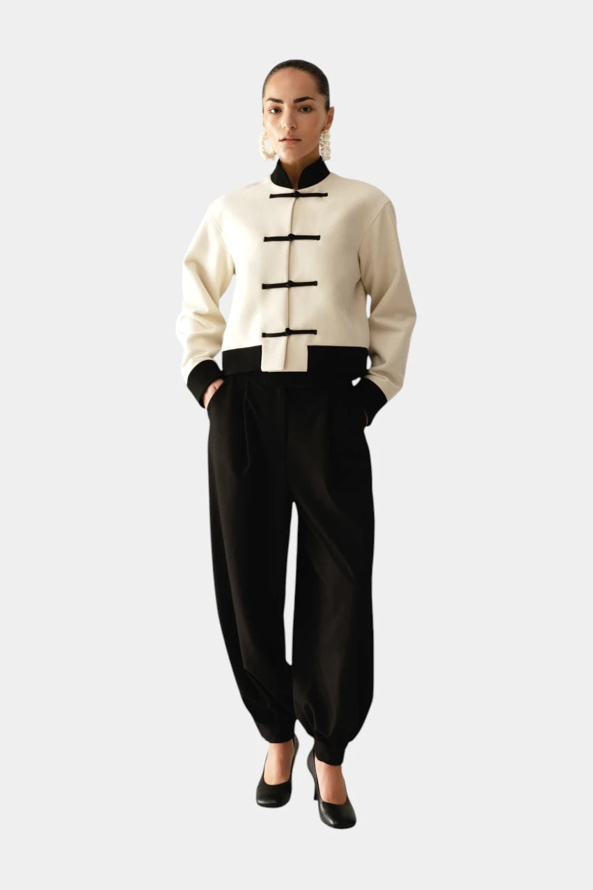 Cream-colored bomber jacket with knotted ties