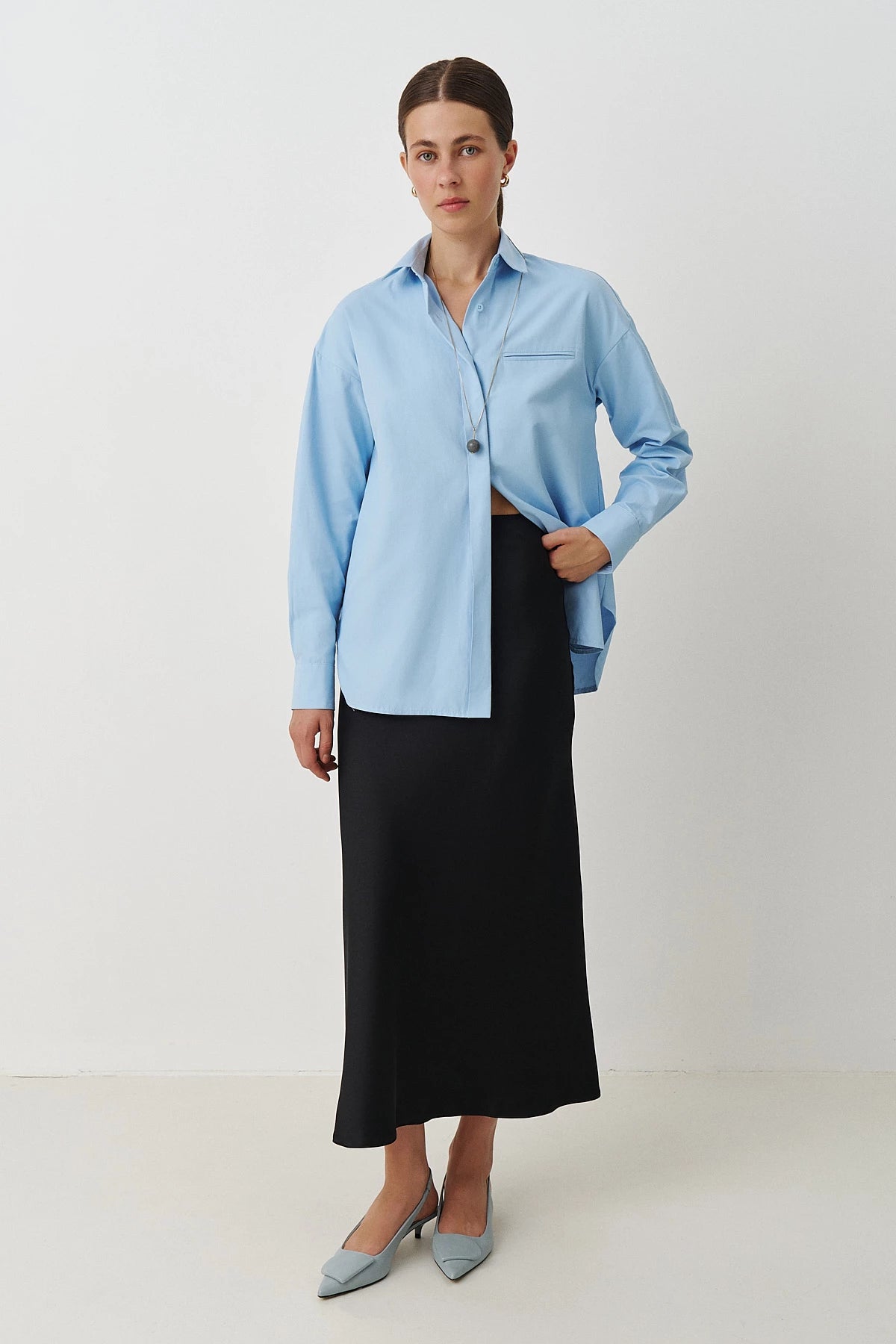 Black long midi skirt made of thick satin