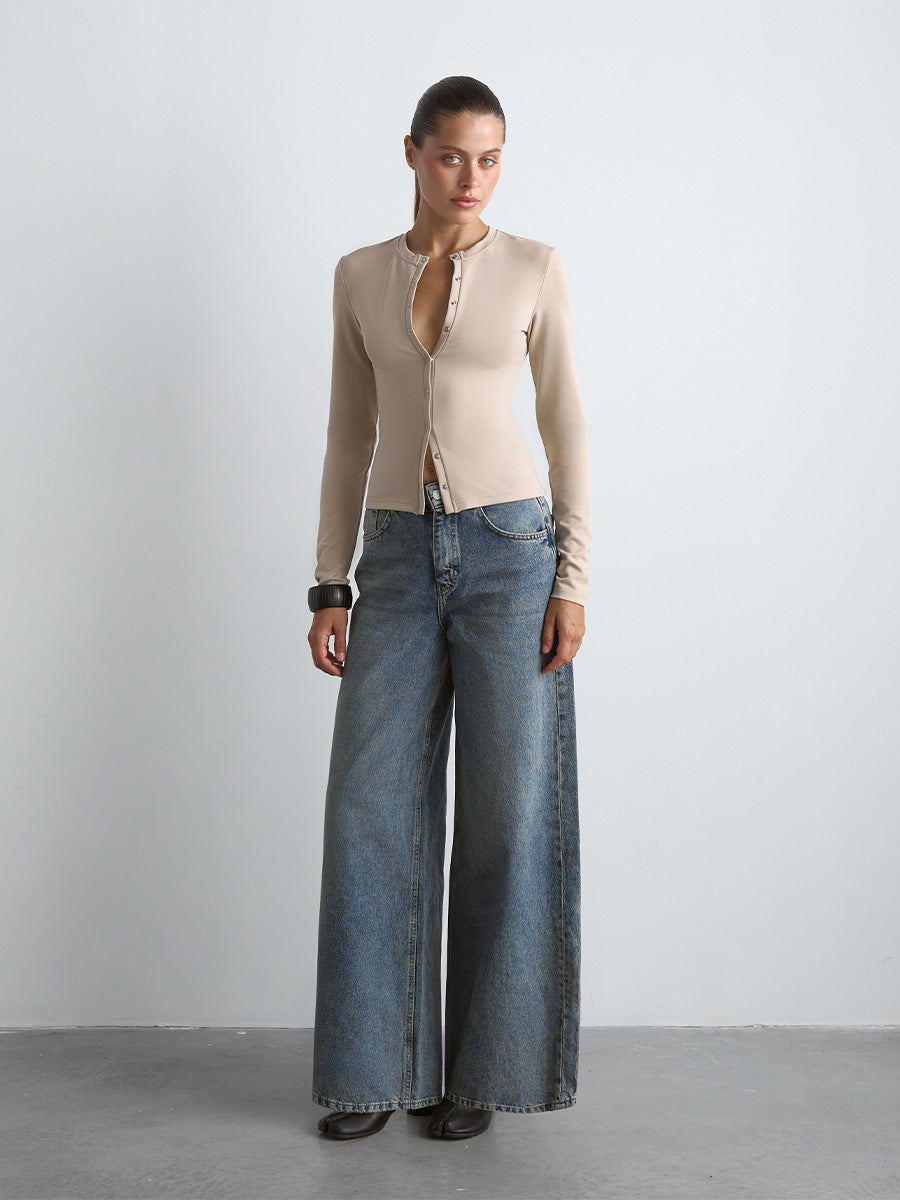 Beige ribbed long-sleeve top with snap buttons