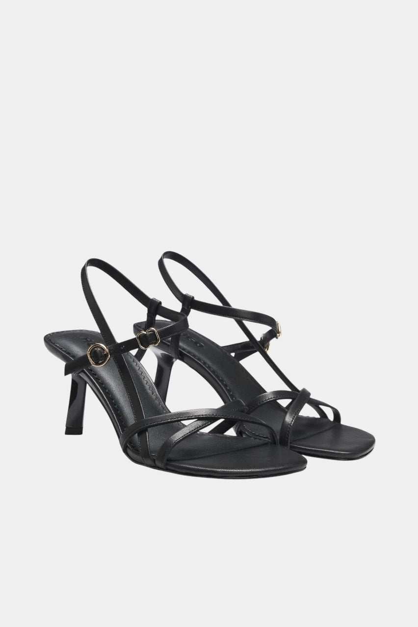 Black leather sandals with asymmetric heels