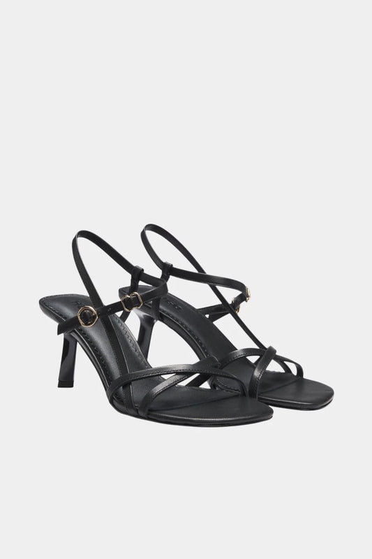 Black leather sandals with asymmetric heels