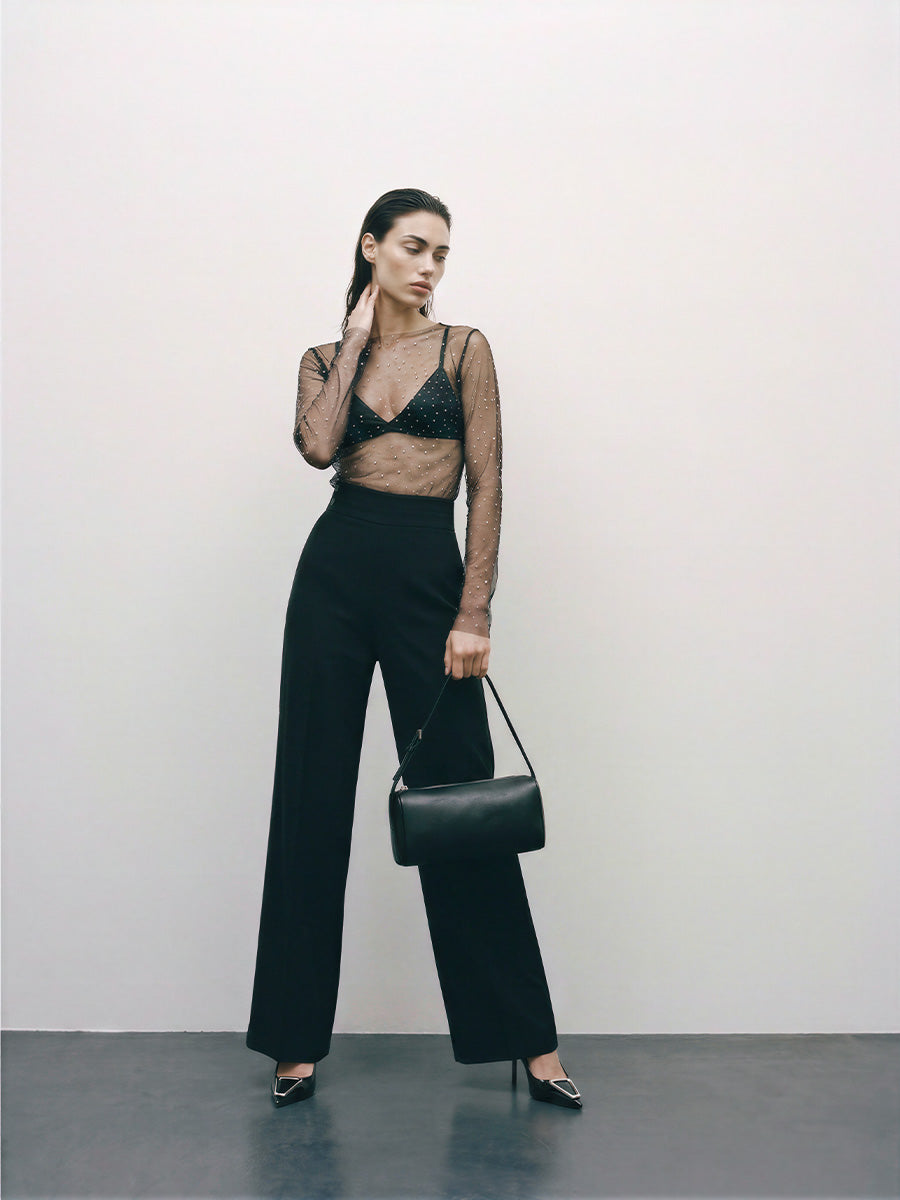 Black straight-leg trousers with an asymmetric fastening