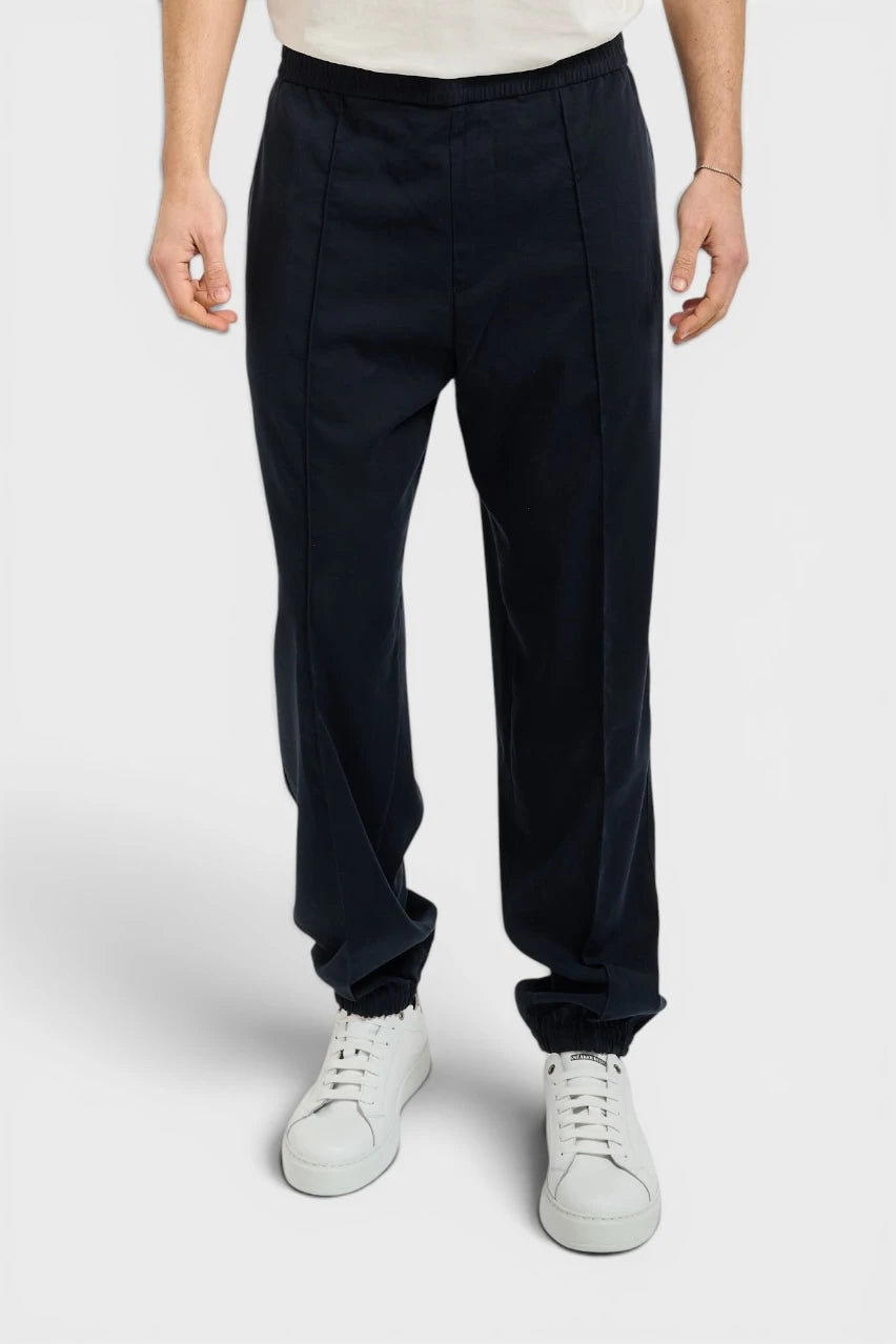 Dark blue trousers with an elastic waistband