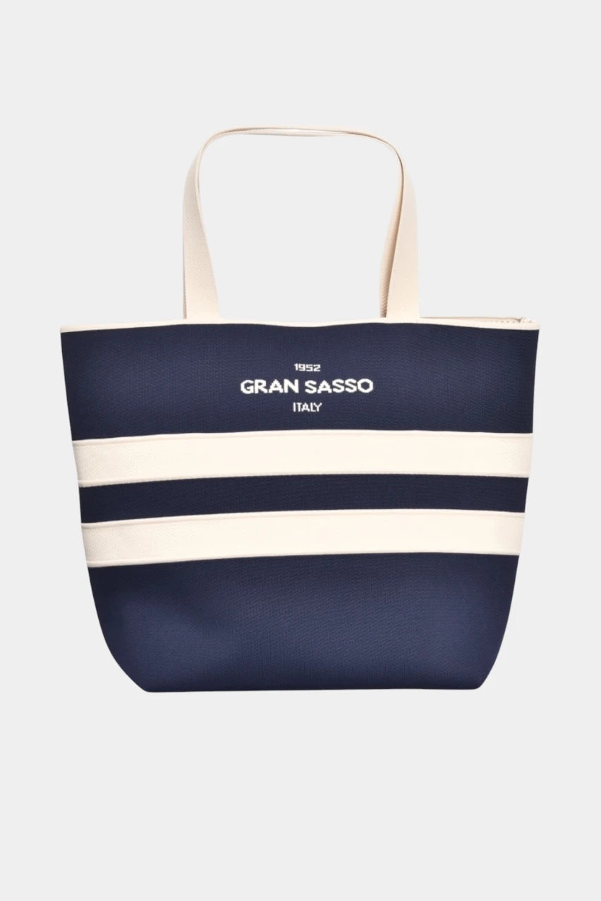 Dark blue beach bag with a textured honeycomb weave