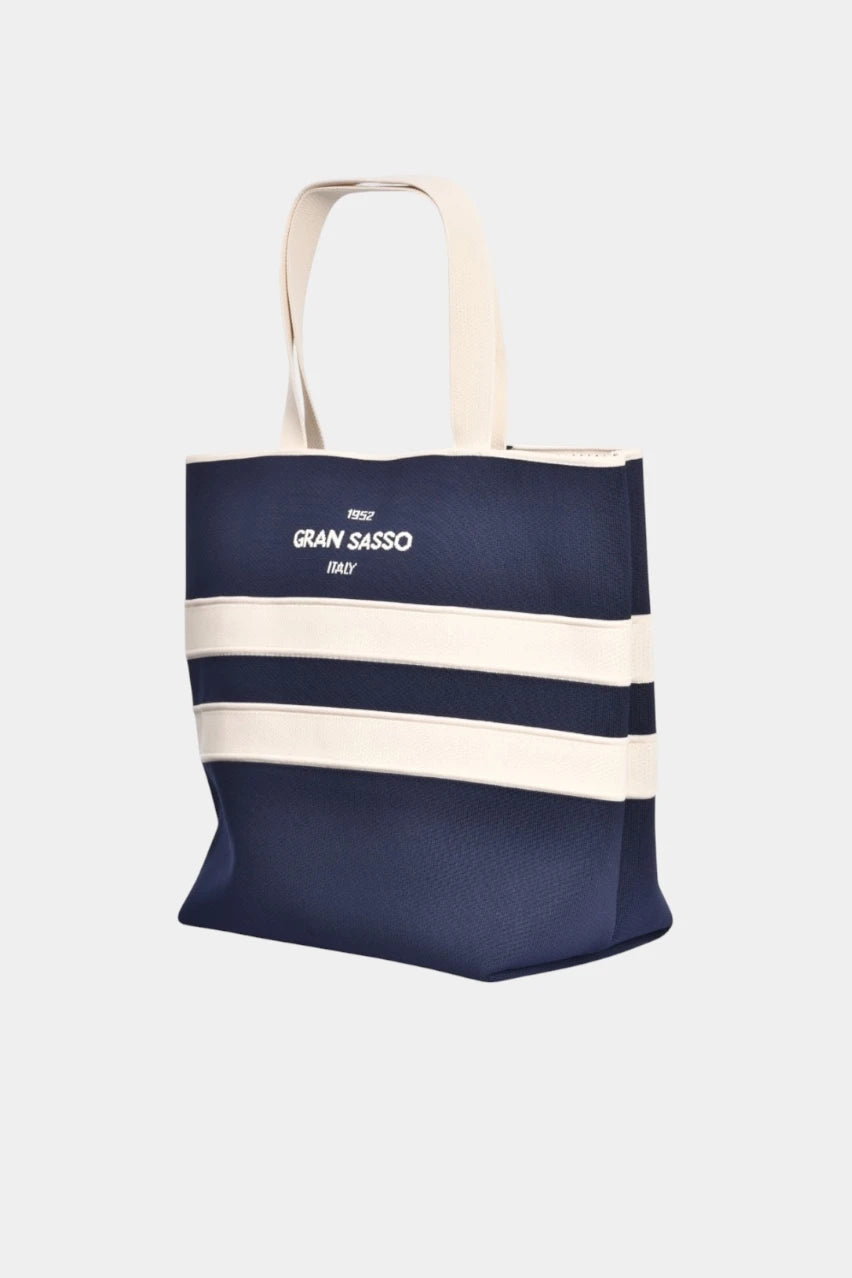 Dark blue beach bag with a textured honeycomb weave