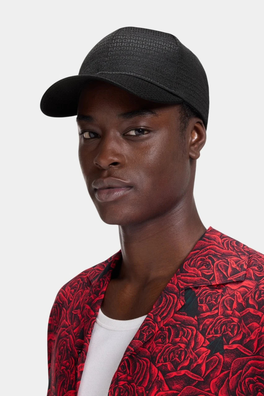 Black Jake-M cap with an all-over jacquard logo