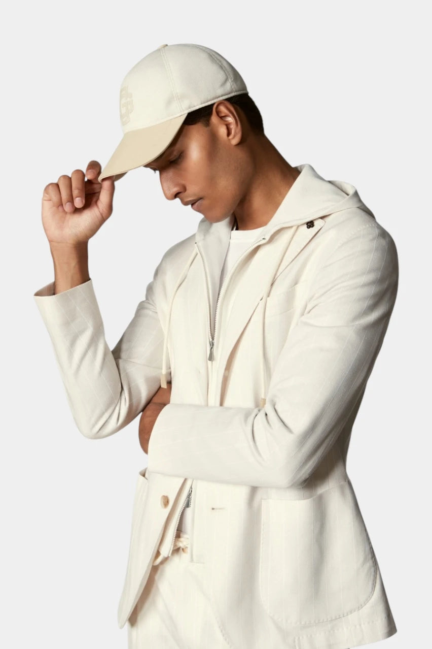 Cream-colored cap with a logo